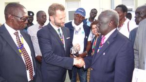 His Excellency Ambassador Alan Hamson hands the bunch of keys for the maternity complexes to the Honorable Minister Dr Riek Gai Kok. Photo WHO 