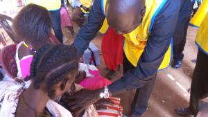 State MoH Director General administering polio vaccine