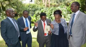  An elated Director of Medical Services Dr Jackson Kioko (centre) and team respond to the news ' Kenya meets the GW Certification criteria' and closer to GW-free status. From left: Drs. John Ogange (WHO), Dr Peter Cherutich (MOH), Dr Joyce Onsongo (DPC, WHO) and Dr Sam Mahugu (MOH)