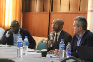 Dr Alemu (with microphone) addressing participants at review of health operations in the northeast Nigeria