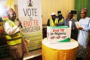 The Honorable Minister casting his "End TB in Nigeria" vote during the Ministerial press briefing to commemorate the World TB Day 2018