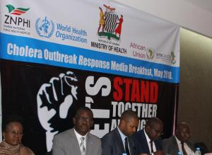 The Minister of Health, Dr. Chitalu Chilufya (4th from left) in the company of the two ministers and the WHO Representative at the media briefing