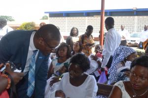 Dr Kaluwa interacts with a nursing mother at a Postnatal Clinic