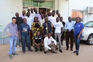 Participants in a group photo with the facilitators