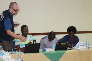 Dr. Boris Pavlin, WHO Epidemiologist  demonstrates the use of an EWARS mobile phone during the training