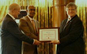 Dr Rudi Eggers, right, WHO Kenya Representative and Dr Werner Schultink, UNICEF Representative, hand over the MNTE certificate to Dr Rashid Aman, Chief Administration Secretary, MOH, Kenya