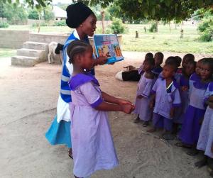 Grace Hyeladi Durkwa talks to young children in their school about how they can protect themselves from cholera in Mubi North, Nigeria (Photo courtesy Grace Hyeladi Durkwa)