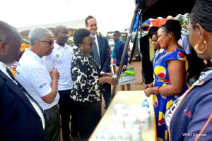   The Minister of Health Dr Jane Ruth Aceng, WHO Representative Dr Yonas, Belgian Ambassador in Uganda H.E Hugo Verbist and other guests inspecting one of the stalls at the WHD commemoration 