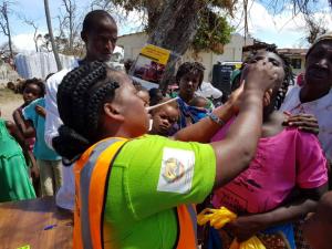 Health worker vaccinating woman