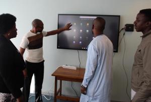 MoHW personnel getting a feel of the interactive equipment at the MoHW Headquarters