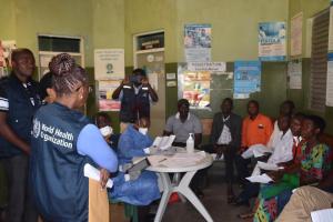 Dr Moeti (WHO Branded Jacket) observes immunization at Bwera Hopsital, Kasese district