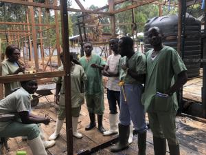 Psychologist team at the Butembo Ebola Treatment Centre meet in their office which was damaged in an arson attack earlier this year.