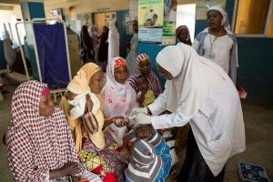 Trained health workers attending patients at a health facility