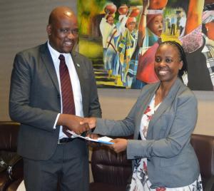 Dr Josephine Namboze, WHO Representative (right) presenting her credentials to the Minister of Health and Wellness, Honourable Dr Alfred Madigele