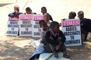 Children holding messages on rabies