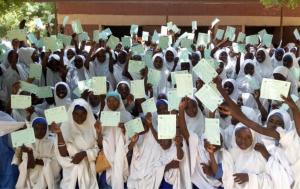 School children showing their yellow fever vaccination cards after receiving the vaccine in Katsina state