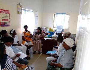 A QoC facility QI meeting facilitated by a QI coach at a PHC in the FCT