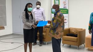 Acting WR, Dr Neema Rusibamayila Kimambo, handing over the official letter to the Minister of Health, Hon. Kwaku Agyemang-Manu