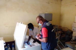 Health officers preparing the Measles vaccine before immunization in Aweil