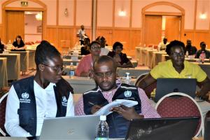 Mr. Hilary Njenge with Ms. Sarah Fordah, WHO Polio STOP consultant and COVID19 Data Mananger at a training of surveillance officers from all 14 regions in Windhoek 