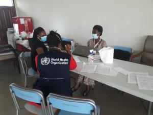 WHO staff and COVID-19 data management team at Prampram and Ablekuma Central verify mapping contacts to cases and checking for completeness of COVID-19 data.