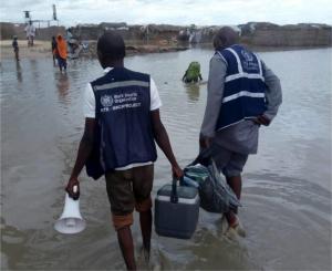 Health Workers wading through tough terrains.jpg