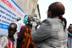 Hon. Elizabeth Acuei Yol, Minister of Health, administaring oral cholera vaccine