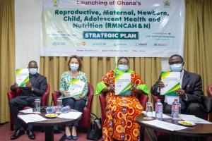 Key personalities at the function display the RMNCAHN document after the official launch