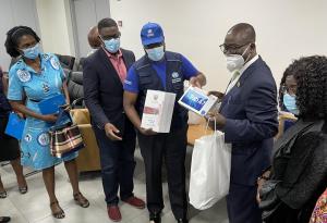 Dr Kasolo handing over items to the Chief Director of the Ministry of Health, Mr Kwabena Boadu Oku-Afari 