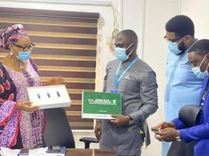 Dr Kofi Boateng alongside Dr Sunny Okoroafor handing over the NHWR soft document to Dr Azodoh at the FMoH_1.jpg