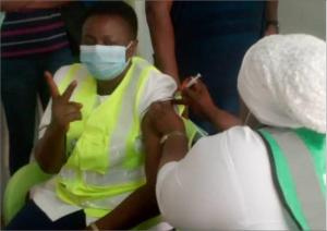 Nurse Mary Yarda, a staff of National Hospital, Abuja receiving the COVID-19 vaccine