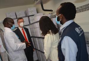Dr Collins Tabu of national Vaccines programme, shows the storage of the  Covax vaccines to Dr Rudi Eggers, WHO Rep, Ms Maxx  UNICEF Rep and Dr Kibet Sergon during the visit  to the Central  vaccine stores in Kitengela