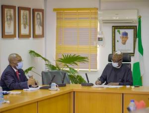 WR (Left) with the Honorable Minister of Federal Capital Territory Mohammed Musa Bello