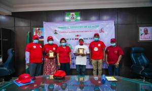 (L-R) Mr Tayo Hamzat, the female highest Donor Barrister Hajara, Representative of Minister of Health, highest male donor, Nathan Akpan, and officials of FMOH