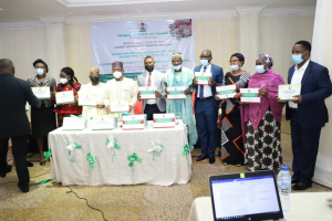 Cross section of participants with the Minister of Health Drs Osagie Ehanire and Edwin Isotu at the launch of the Food Safety Training Manual in Abuja