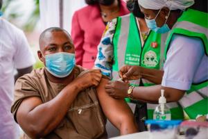Alhaji Hassan a police officer receiving COVID-19 vaccine during the flag-off of the second phase covid-19 vaccination at FMC Jabi, Abuja.j