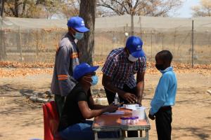Technical staff assessing a learner at Parakarungu Primary School in the Chobe district on MDA impact