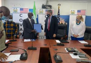 The Ambassador of the United States to Sierra Leone (right) and the Deputy Minister of Health and Sanitation (Left) at the official handing over event of the vaccine