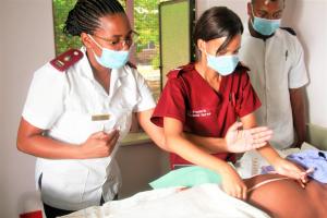 Health care workers providing care to a pregnant woman 