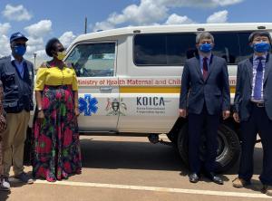 Left to Right: WHO Representative Dr Yonas Tegegn Woldemariam, Minister of Health in charge of Primary Health Care Hon Margaret Muhanga, Korean Ambassador to Uganda H.E Ha Byung-Kyoo and KOICA Director Mr Kim Taeyoung stand next to one of the seven ambulances given to Kamuli hospital from the project.