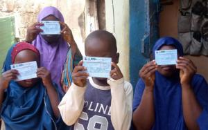 Children showing their OCV cards.jpg