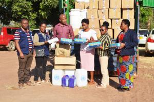 WHO team handing over items and supplies to the Katavi Regional Health Management Team