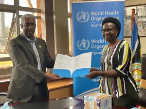 WHO Representative to Uganda, Dr Yonas Tegegn Woldemariam handing over 2400 monkeypox tests to the Minister of Health Hon Dr Jane Ruth Aceng Acero.