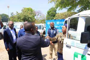 Hon. Minister for Health receiving keys for one of the vehicles donated by WHO