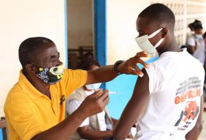 Mobile vaccination team vaccinating community members in Nimba county.