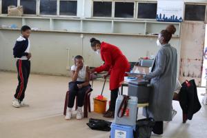 Vaccination Campaign teams administering the vaccine to school children around Mbabane