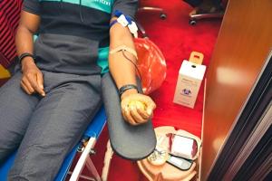 A donor donating blood during the UN blood drive to mark World Blood Donor Day