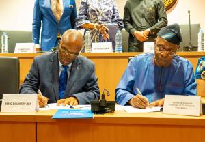 Lt. Gen. Danjuma and Dr Kazadi Mulombo (WR Country Representative) during the signing of the partnership