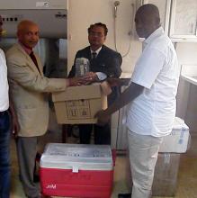  Dr Alemu L handing over reagents and supplies to Prof Gevao
