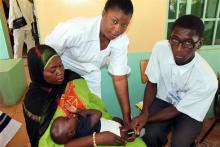 03 A child being vaccinated at a health facility during AVW